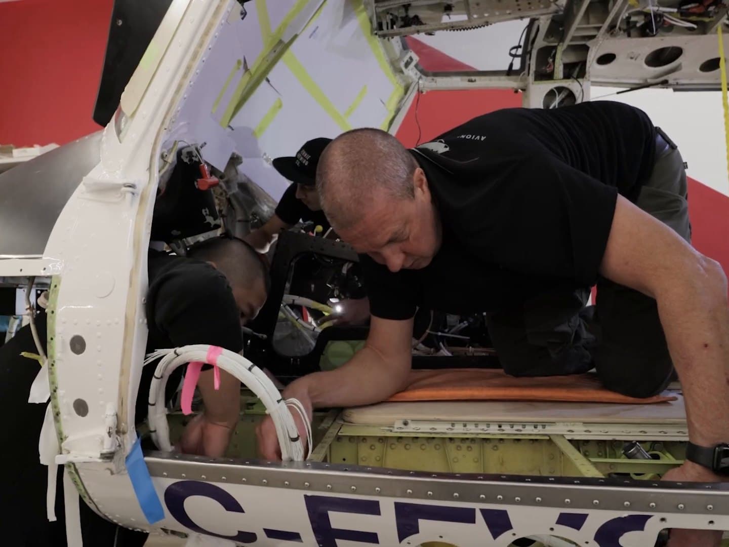 IAS technicians rewiring a Bell 412 cabin at the Kelowna facility