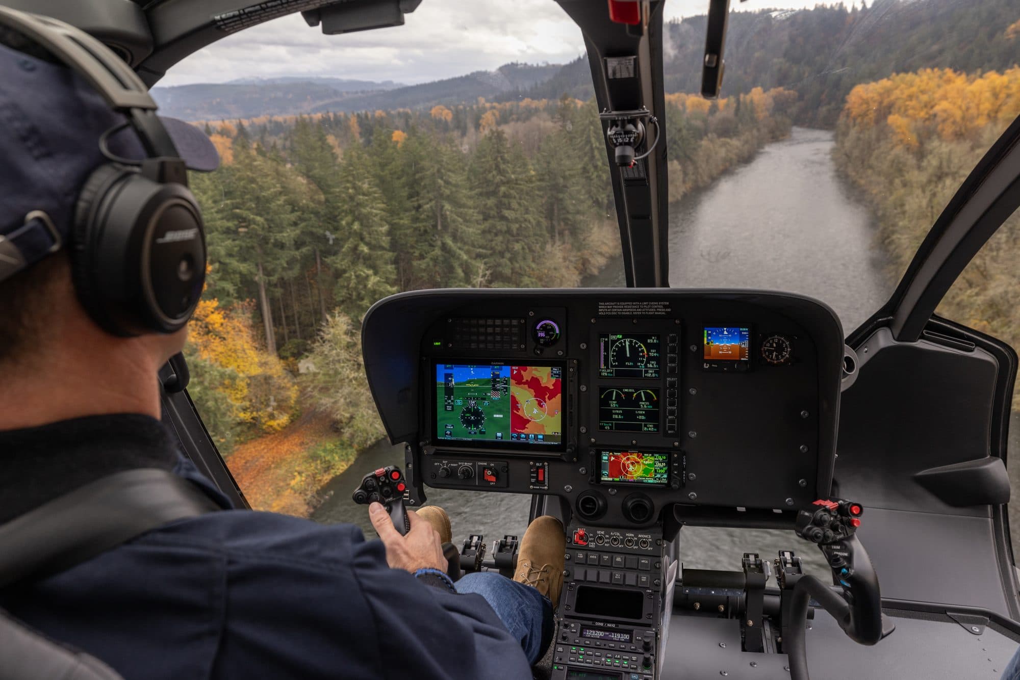 Helicopter pilot flying with Garmin flight displays